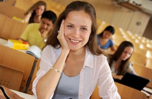 A student in the Main Lecture Theatre (Audimax)