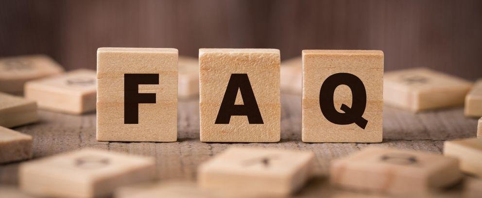 Wooden cube labelled with FAQ