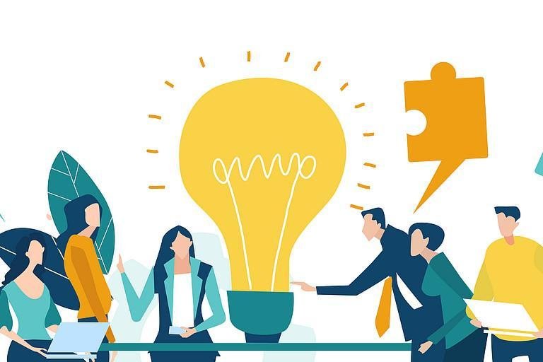 People talking large light bulb in the centre