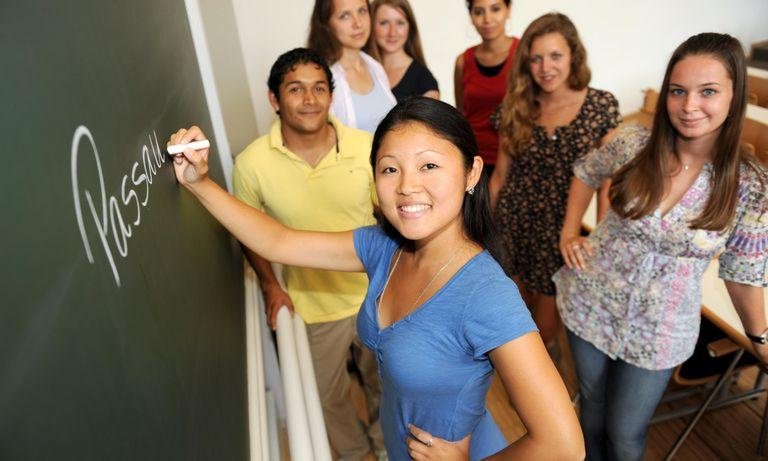 International students in front of a blackboard