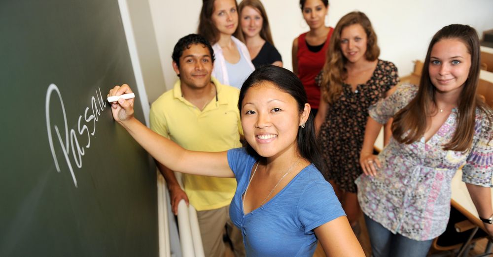 International students in front of a blackboard