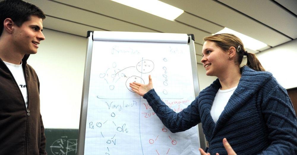 Students in front of a flipchart