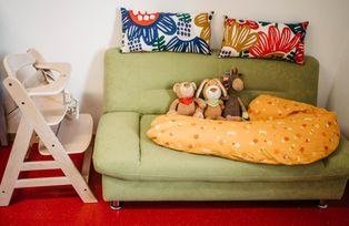 Sofa with breastfeeding pillow