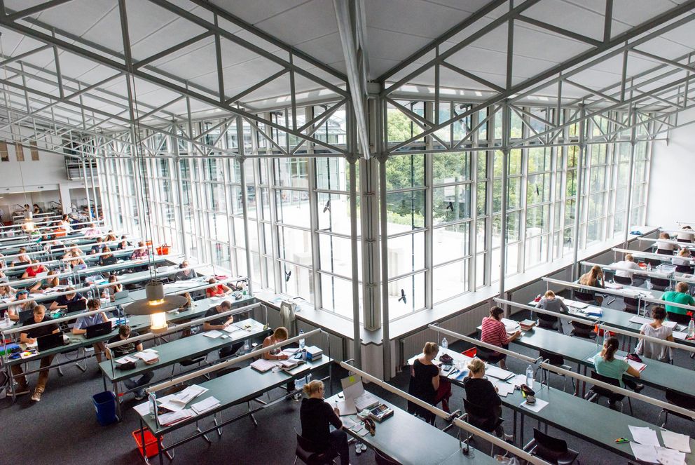 Students studying in one of the University Library reading rooms