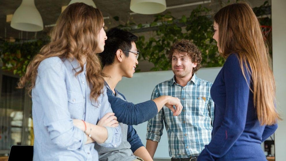 Students exchange ideas with each other Students exchange ideas with each other