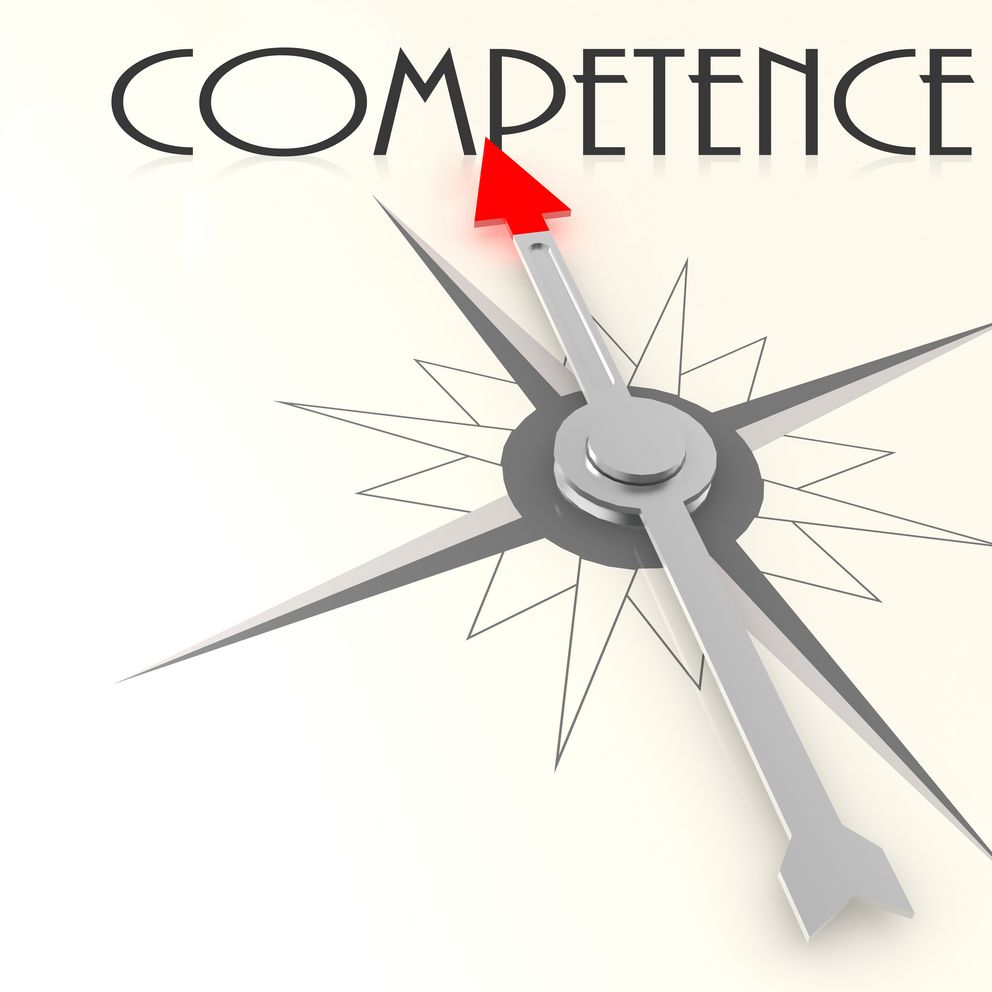 Kompassnadel zeigt auf das Wort "competence"
