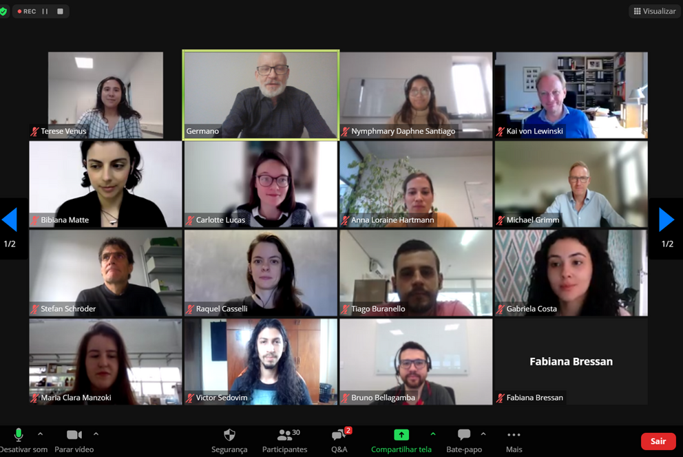 Screenshot of Zoom meeting, showing the faces of participants