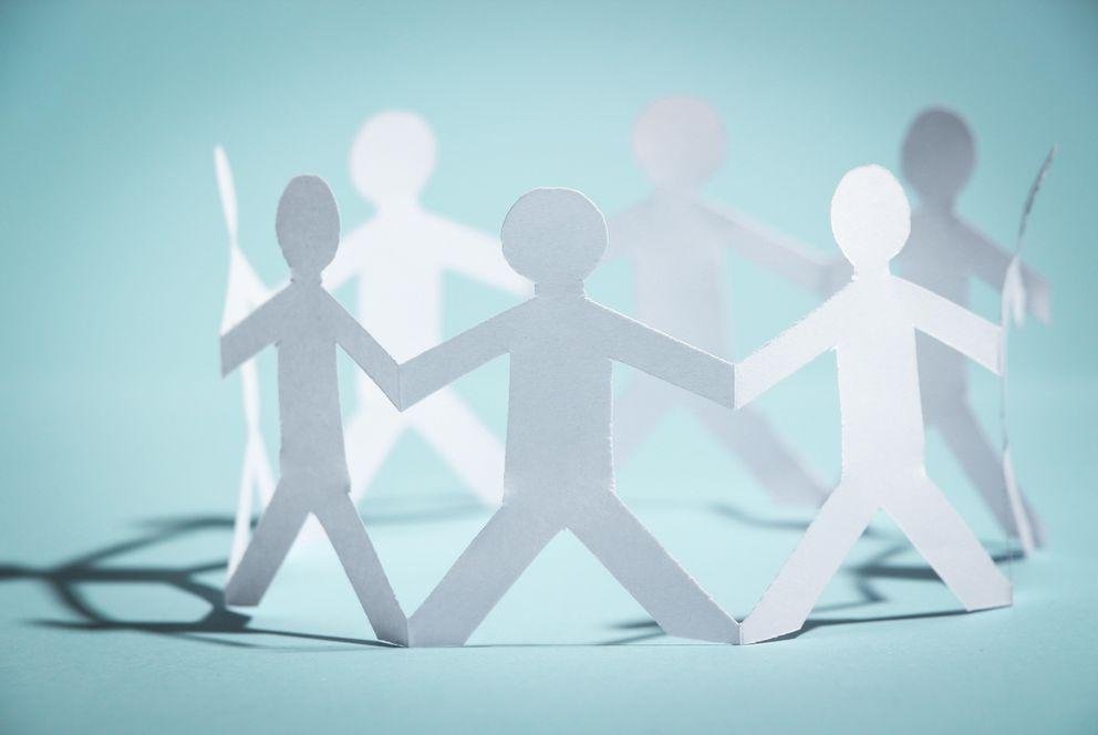 Group of people holding hands