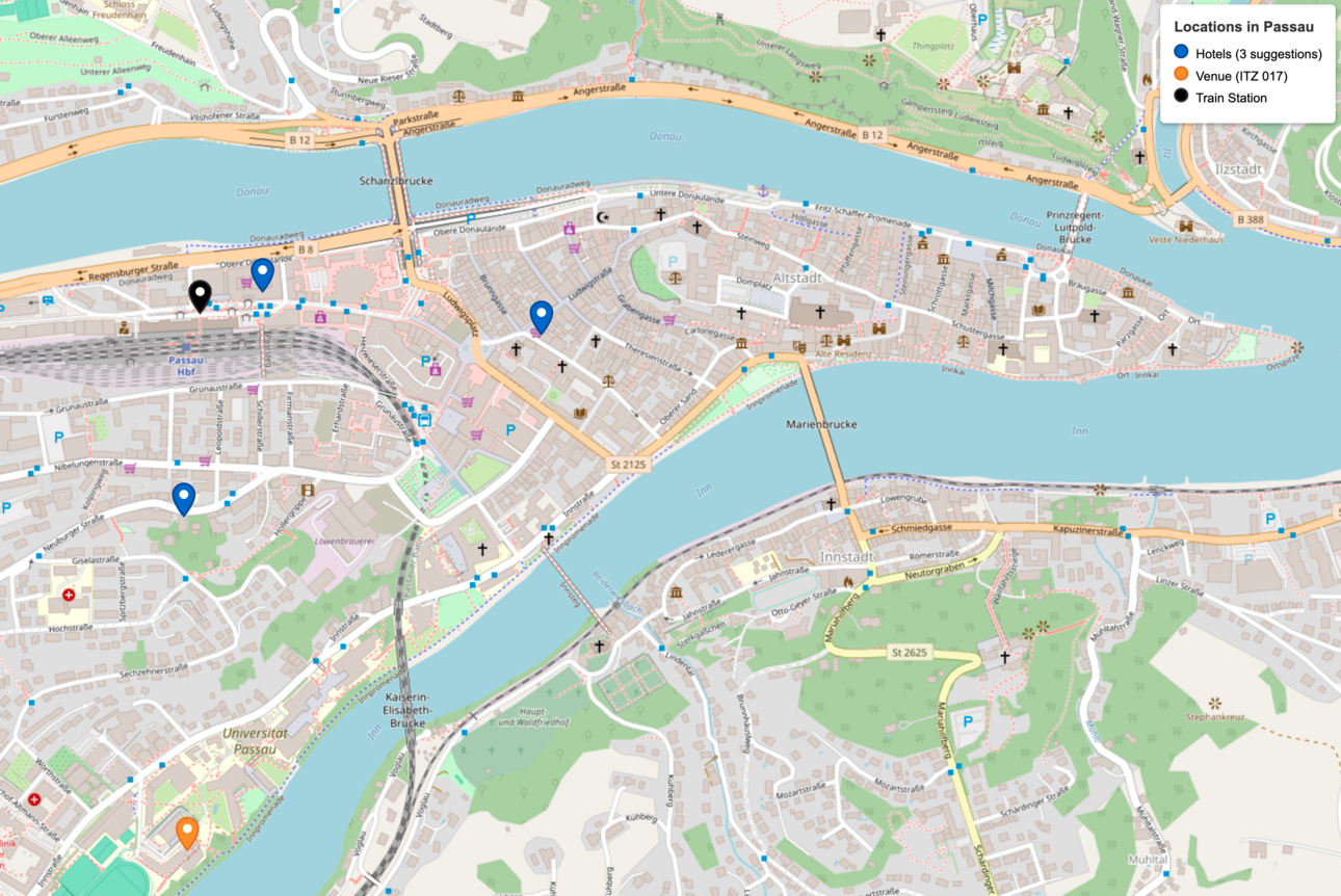 The map (based on openstreat map) shows the city center of Passau, Germany, and conveys the information that the three hotels als well as the train station are within walking distance of the venues' location at the Universit of Passau (ITZ 017)