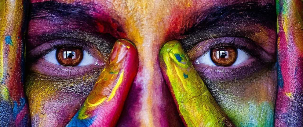 person whose face is painted with paint