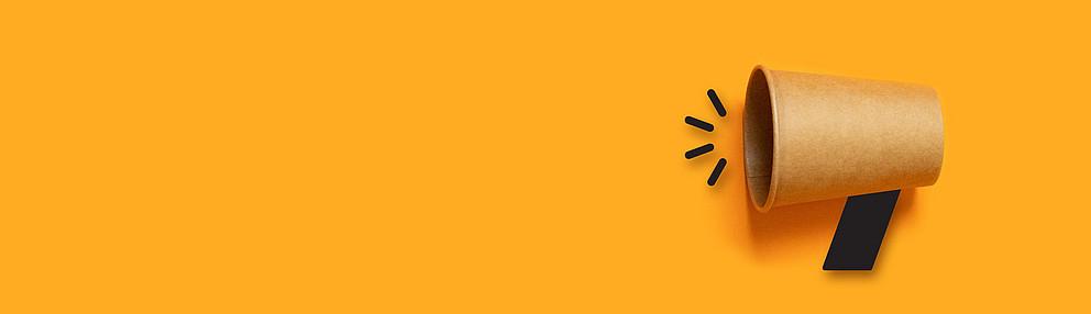 business concept image with paper cup on orange background with