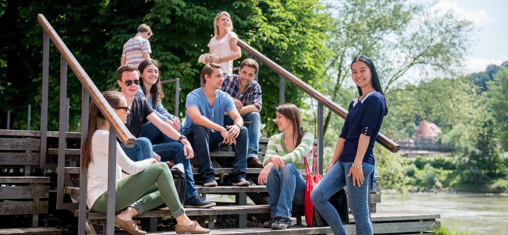 students sitting on a staircase 